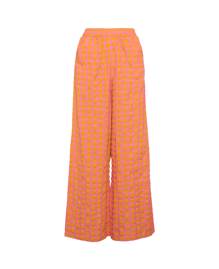 Front of Pink Orange seersucker wide leg pants with elastic waist and side pockets.