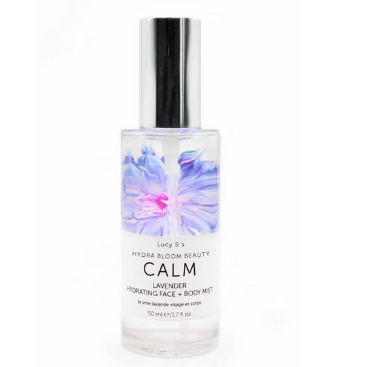 Clear spray bottle featuring a lavender floral design on the label, displaying "Hydra Bloom Calm Lavender Face and Body Mist | Hydra Bloom," ideal for skincare and body care routines.