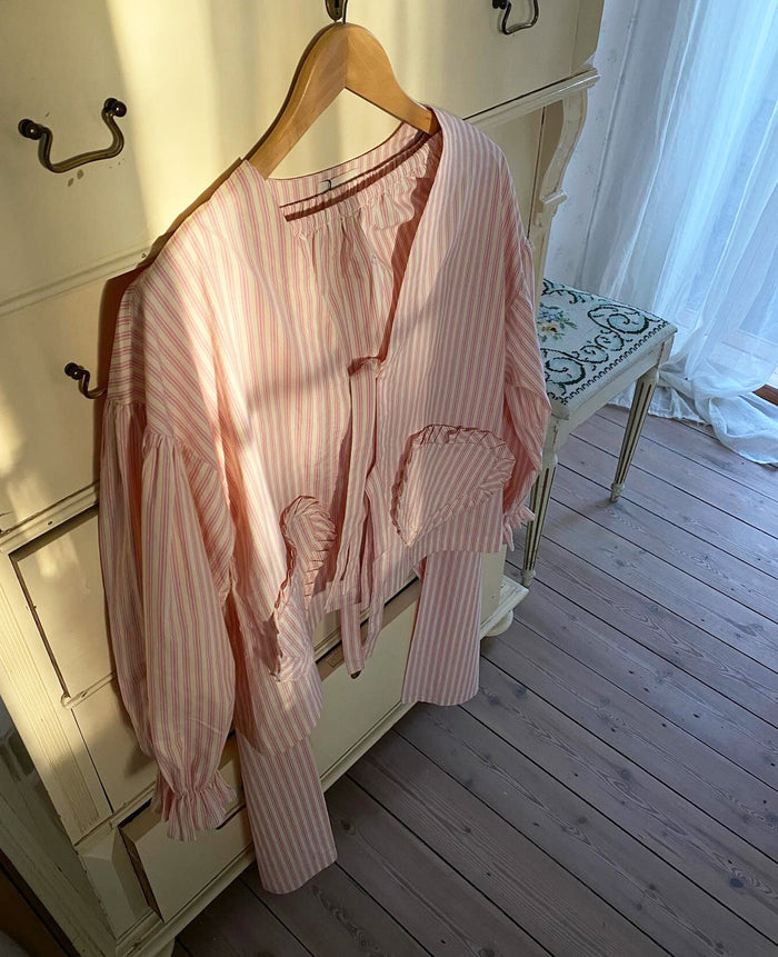 Pink stripe women's top with heart shaped front pockets and ties hanging on cupboard door - ANNIE.G