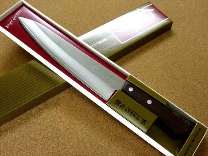 A  Kanetsugu Miyabi Issin Chef Knife in its packaging with Japanese kanji.