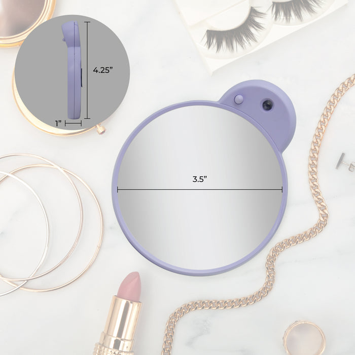 Zadro FC10LLVD 705004423977 environment photo mirror on makeup table with dimensions, lighted compact mirror with magnification & retractable suction cups in front of a real life setting