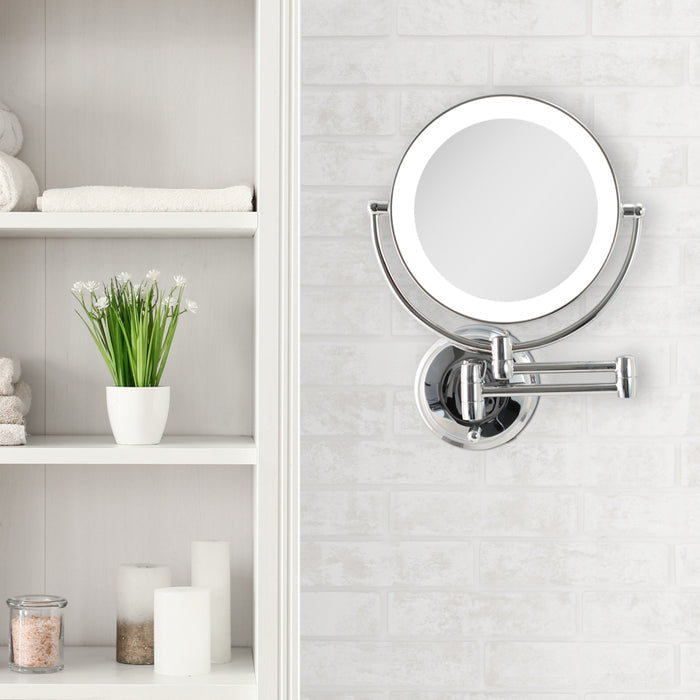 Zadro LEDW310 705004421805 environment photo front view on textured wall, lighted wall mounted makeup mirror with magnification & extendable arm in front of a real life setting