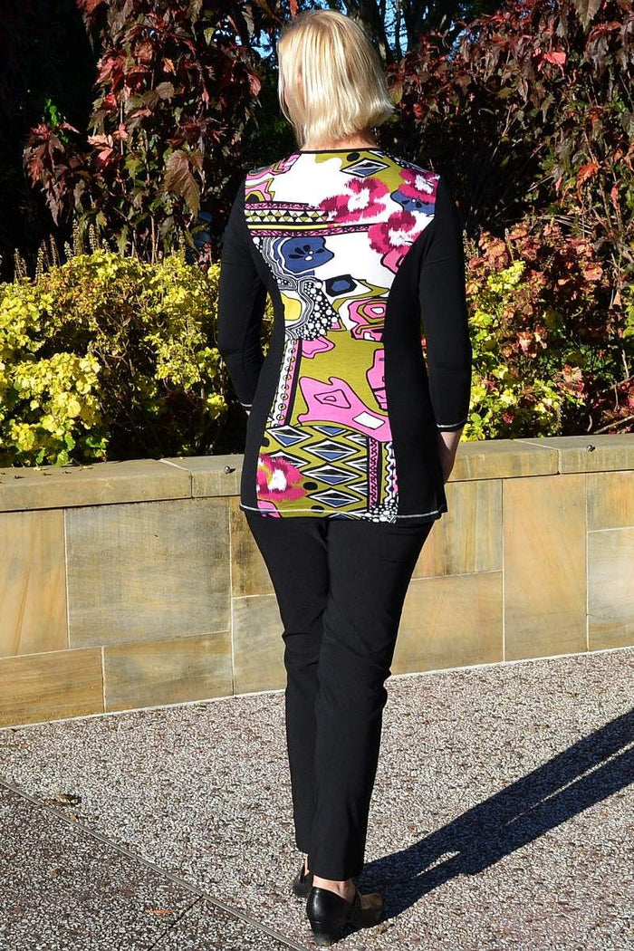 Jenny May Louise Tunic Top, lightweight flowy tunic with long sleeves and a relaxed fit, displayed on a hanger.