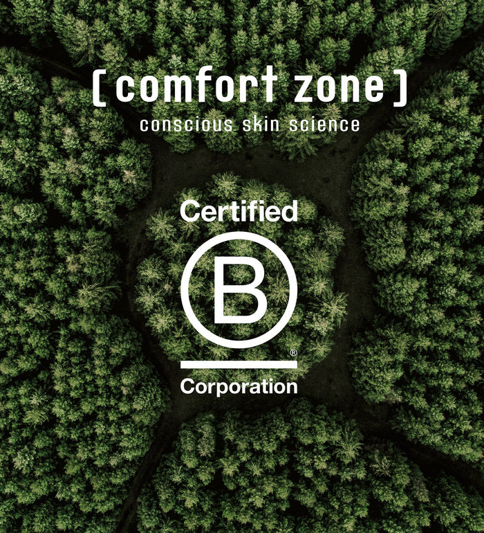 Aerial view of dense green forest with the text "[ comfort zone ] conscious skin science Certified B Corporation" overlayed, representing the brand's commitment to sustainable skincare and wellness with Luminant Cream | [ comfort zone ].