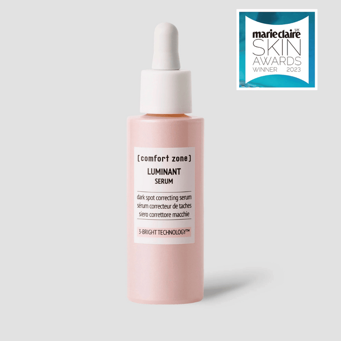 Bottle of Luminant Serum | [ comfort zone ] with dropper cap for skincare, displayed alongside a Marie Claire Skin Awards 2023 winner badge.