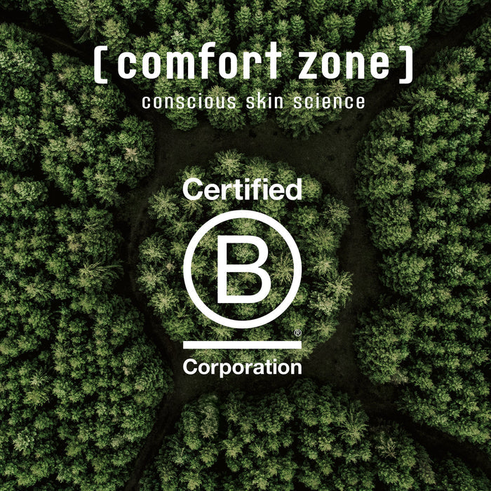 Aerial view of a dense green forest with the text "[ comfort zone ] conscious skin science Certified B Corporation" overlayed, symbolizing eco-friendly skincare for Luminant Serum | [ comfort zone ].
