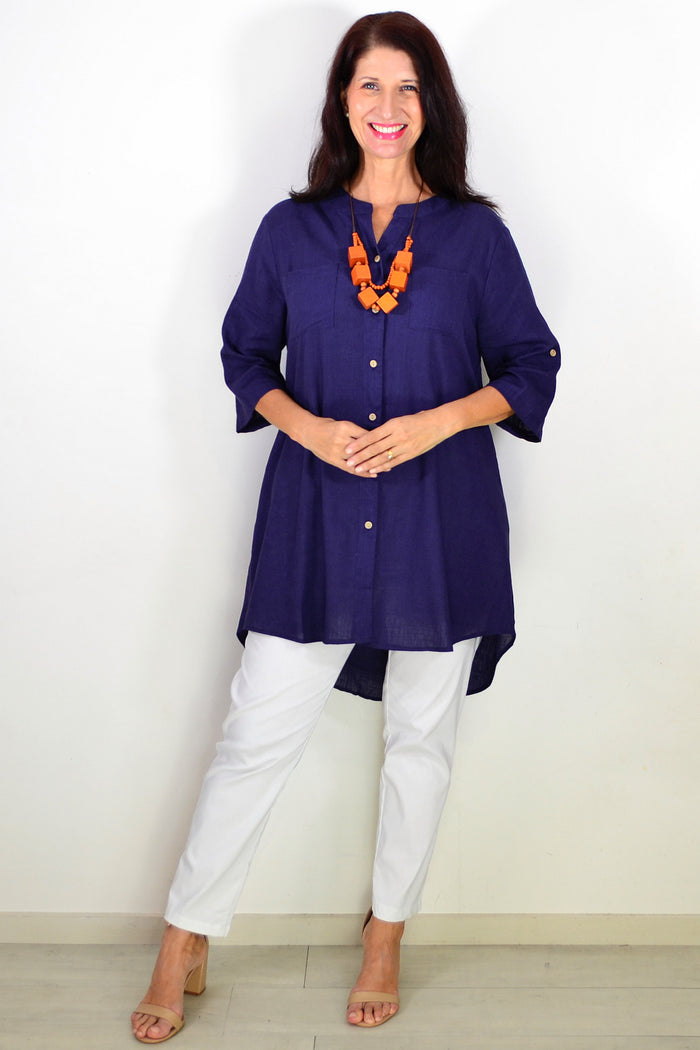 Navy block hi-low relaxed tunic shirt by Ruby Rain, featuring a casual fit and stylish design, displayed on a hanger.