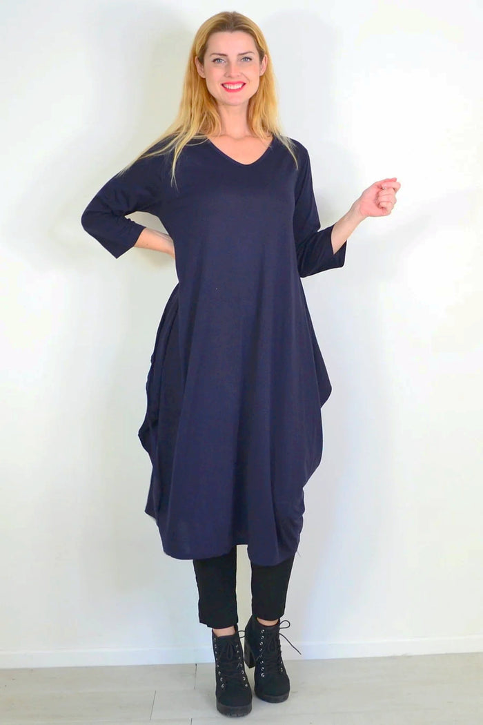 Navy blue Lilia Whispers oversized relaxed tunic dress with long sleeves and a loose fit, styled on a model.