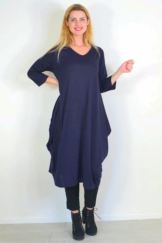 Navy blue Lilia Whispers oversized relaxed tunic dress with long sleeves and a loose fit, styled on a model.