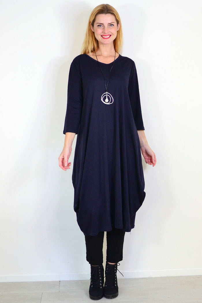 Navy blue relaxed oversized tunic dress by Lilia Whispers, shown on a hanger with soft fabric and casual fit.