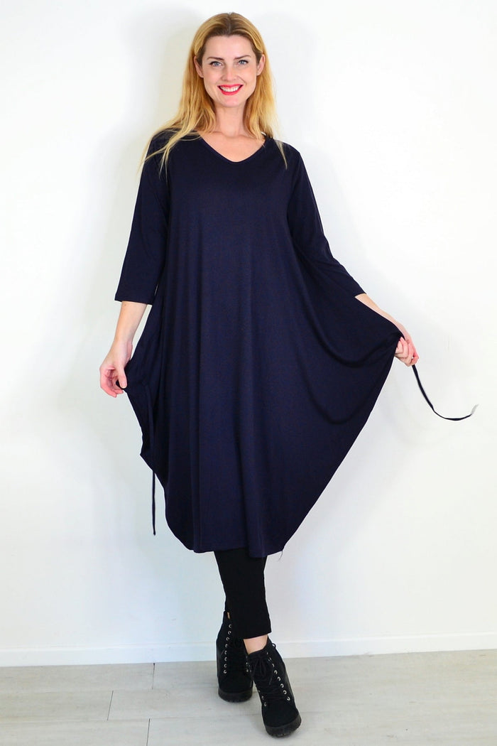 Navy blue Lilia Whispers relaxed oversized tunic dress with a loose fit, displayed on a mannequin against a neutral background.