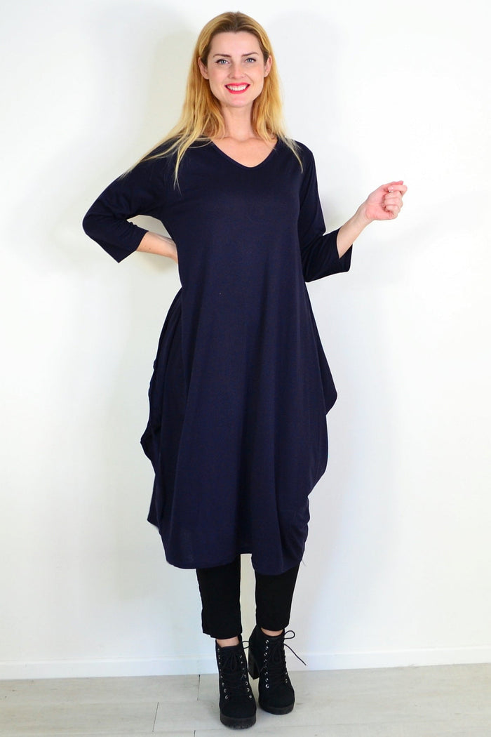 Navy blue relaxed oversized tunic dress by Lilia Whispers, featuring a loose fit and comfortable fabric, displayed on a hanger.