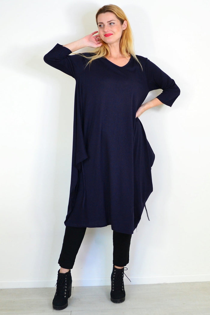 Navy blue oversized tunic dress by Lilia Whispers, relaxed fit with flowing fabric, displayed on a hanger.