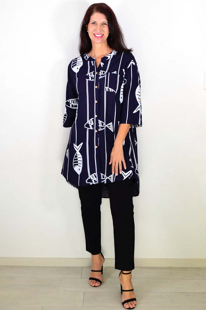Navy hi-low relaxed tunic shirt by Ruby Rain, featuring a flowy fit and casual style, displayed on a hanger.