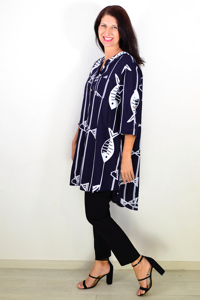 Navy Hi Low Relaxed Tunic Shirt by Ruby Rain, featuring a loose fit and casual style, displayed on a hanger.