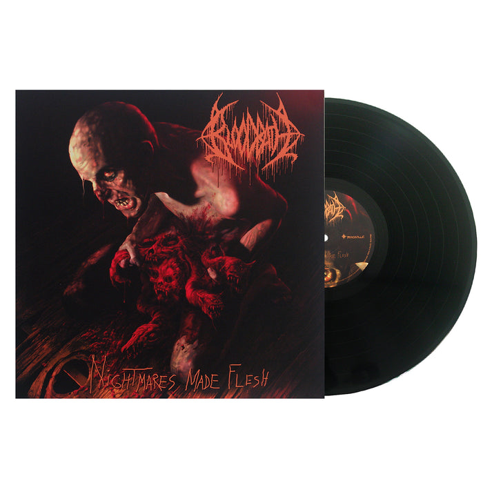 The image shows a Bloodbath vinyl record partially out of its sleeve. The cover displays dark, gruesome art with monstrous figures and bloody creatures, featuring the text Nightmares Made Flesh and Bloodbath.