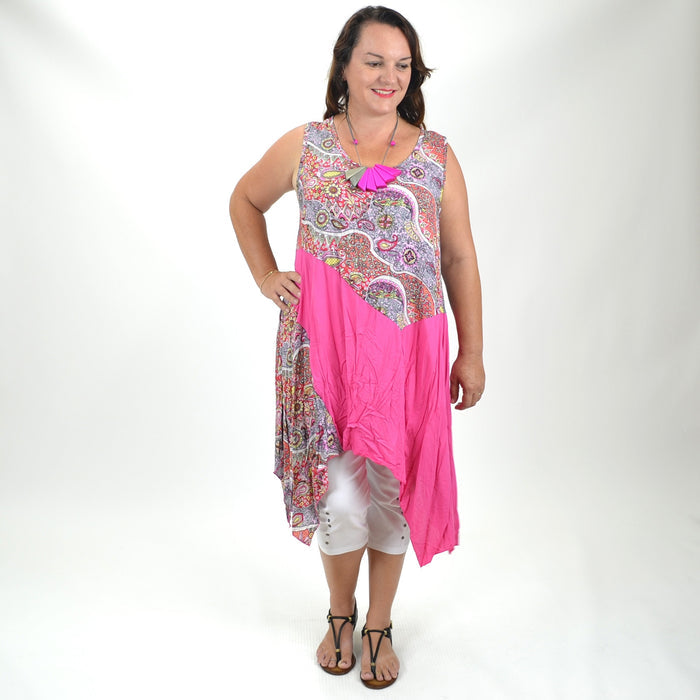 Pink Jodie Tunic by Quelque, lightweight and flowy with long sleeves, displayed on a hanger against a neutral background.