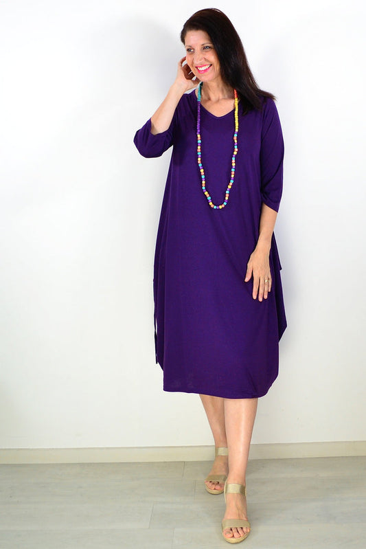 Purple relaxed oversized tunic dress by Lilia Whispers, shown on a model with a flowing, comfortable fit and casual style.