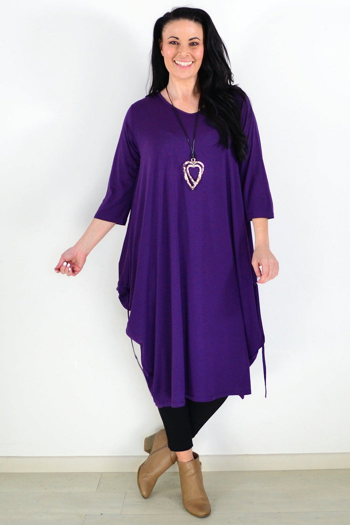 Purple Lilia Whispers oversized tunic dress with relaxed fit, flowing fabric, and long sleeves, displayed on a hanger.
