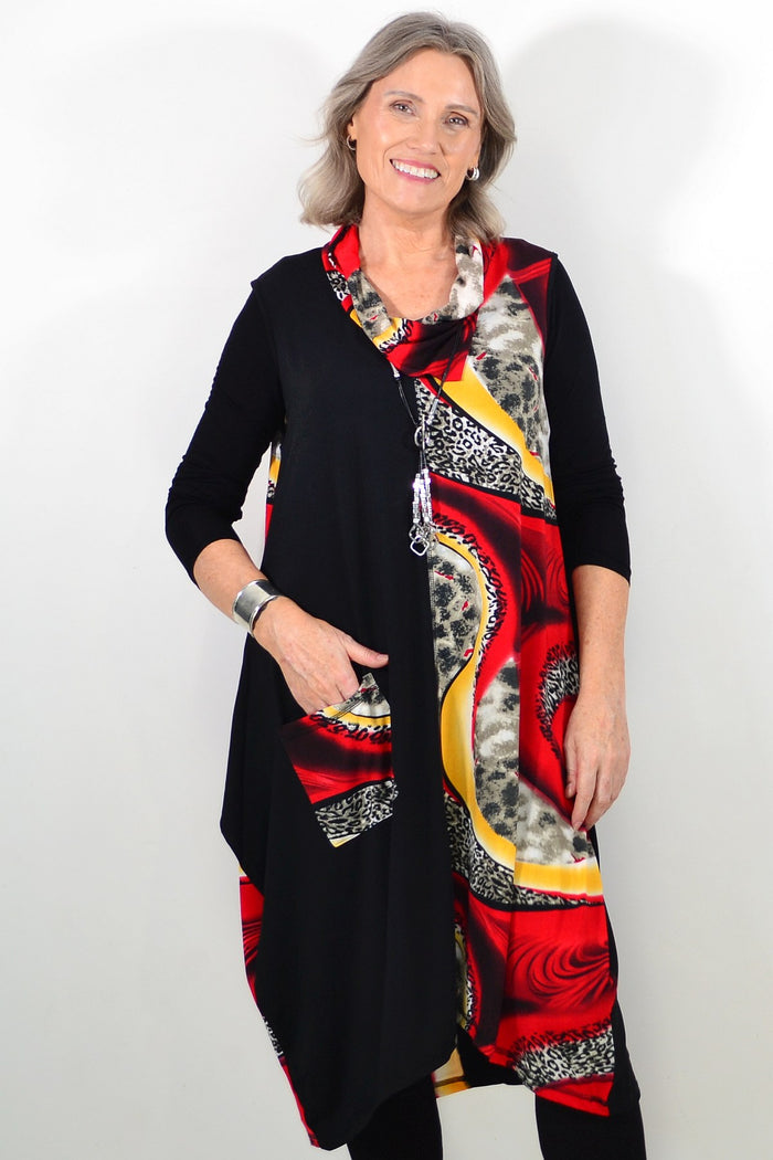 Red leopard print sleeveless tunic dress by Whispers, showcasing the vibrant pattern and relaxed fit on a model.