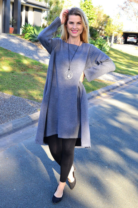 Relaxed grey textured Peony tunic dress with a loose fit and stylish design, shown hanging on a mannequin.