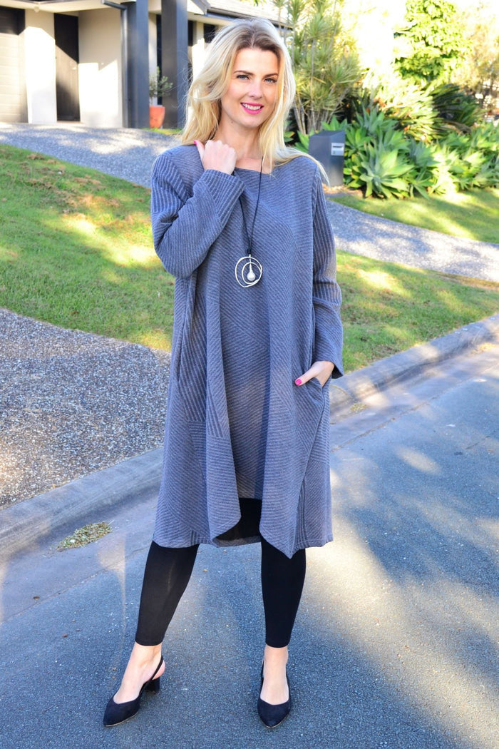 Relaxed grey textured peony tunic dress displayed on a hanger, showcasing its casual, comfortable fit and soft fabric.