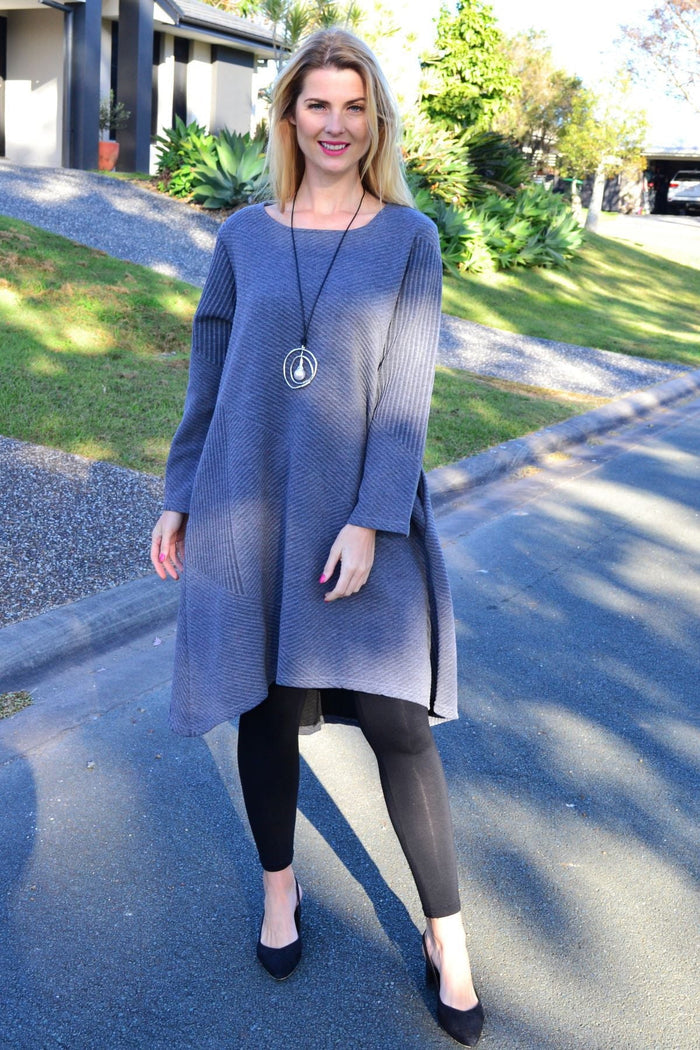 Relaxed grey textured Peony tunic dress with a loose fit and subtle fabric pattern, displayed on a hanger against a neutral background.