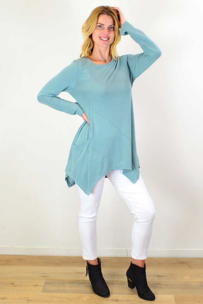 Sage green knit tunic top by Caroline Morgan, featuring a relaxed fit and textured fabric, shown on a model.