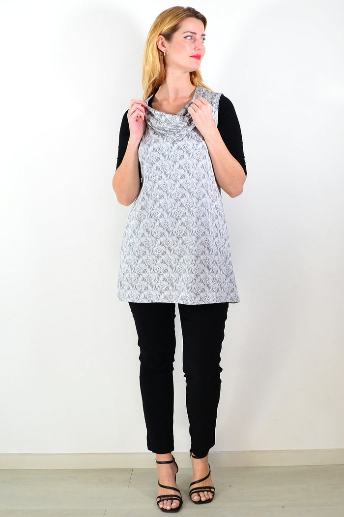 Silver rose sleeveless tunic top by Lilia, featuring a flowy fabric and stylish design, displayed on a hanger.
