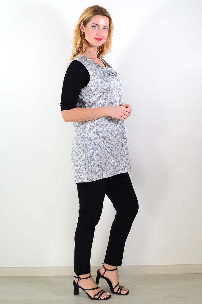 Silver rose sleeveless tunic top by Lilia, featuring a flowy fabric and sleeveless design, displayed on a hanger.