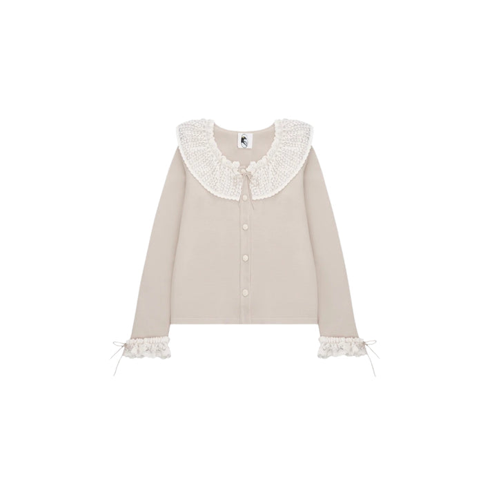 Beige cardigan with ruffled collar and white lace trim, ties and buttons.