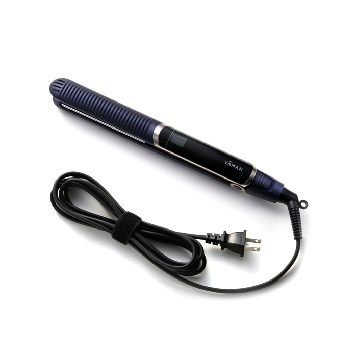 Black and blue hair straightener with plug on a white background