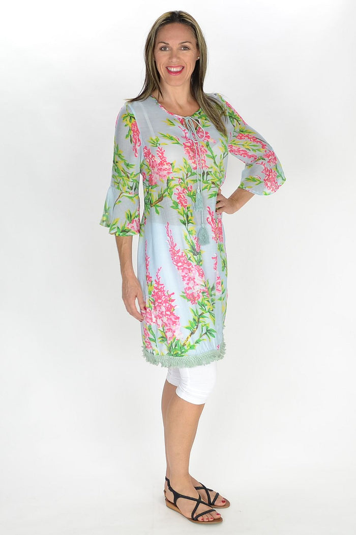 MSTYLE Summer Flowers Tunic featuring vibrant floral print, lightweight fabric, and relaxed fit, ideal for warm weather wear.