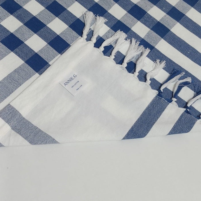 ANNIEG brand label on Blue and white checked tablecloth with hand knotted fringe - ANNIE.G