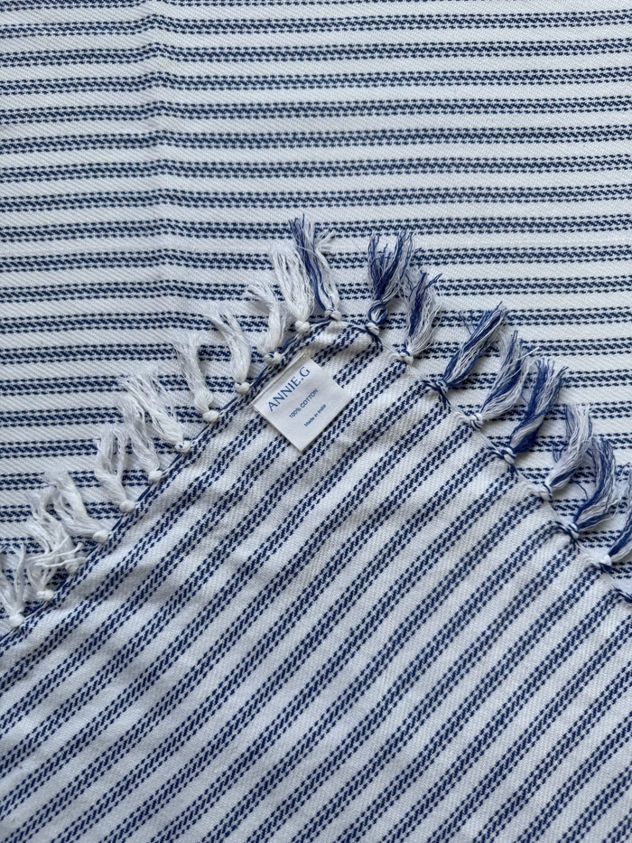 square-tablecloth-true-blue-ticking-folded-edge-showing-brand-label