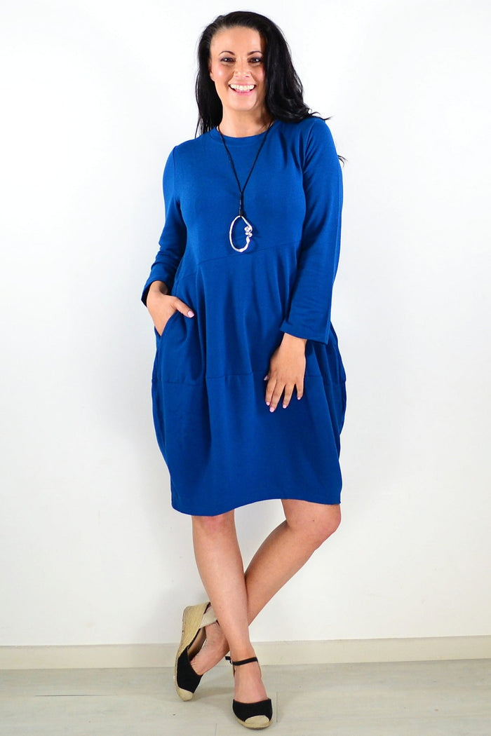Teal cocoon winter pocket tunic dress by Peony, featuring a relaxed fit, long sleeves, and side pockets on soft fabric.
