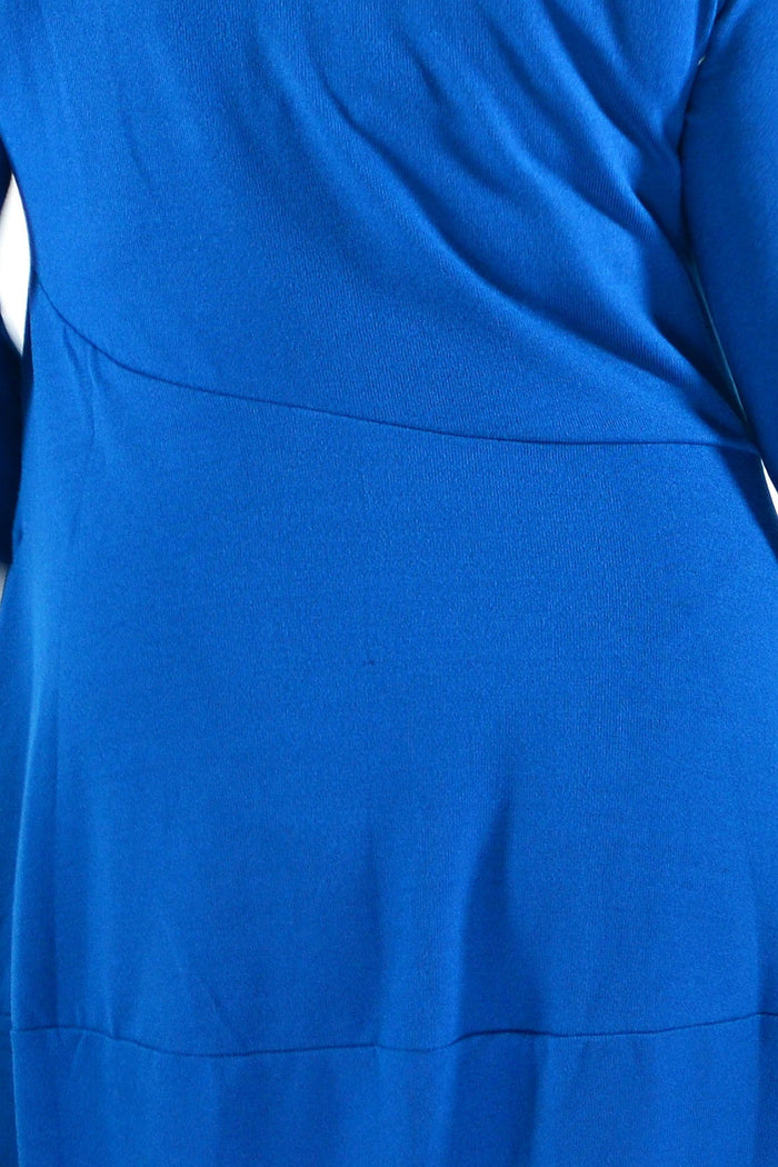 Teal cocoon winter pocket tunic dress by Peony, featuring a cozy, loose fit with side pockets and long sleeves.