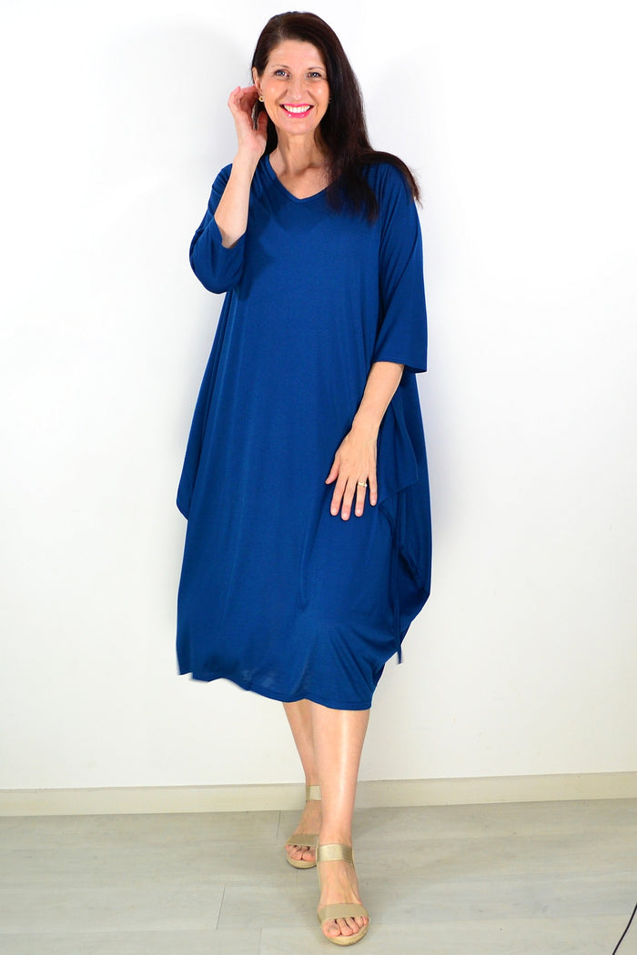 Lilia Whispers teal relaxed oversized tunic dress with long sleeves and a loose fit, displayed on a mannequin.