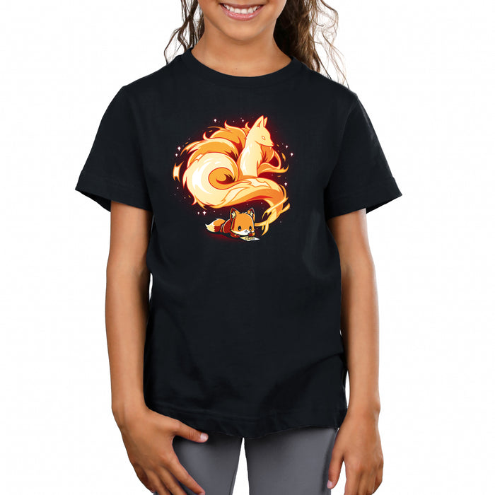 Premium Cotton T-shirt_TeeTurtle The Mind of an Artist black t-shirt featuring an illustration of an orange fox lying down contently drawing. The drawing appears to come from the little fox's thoughts, which shows an older orange fox with a long, fluffy and spiraling tail that resembles fire surrounded by stars.