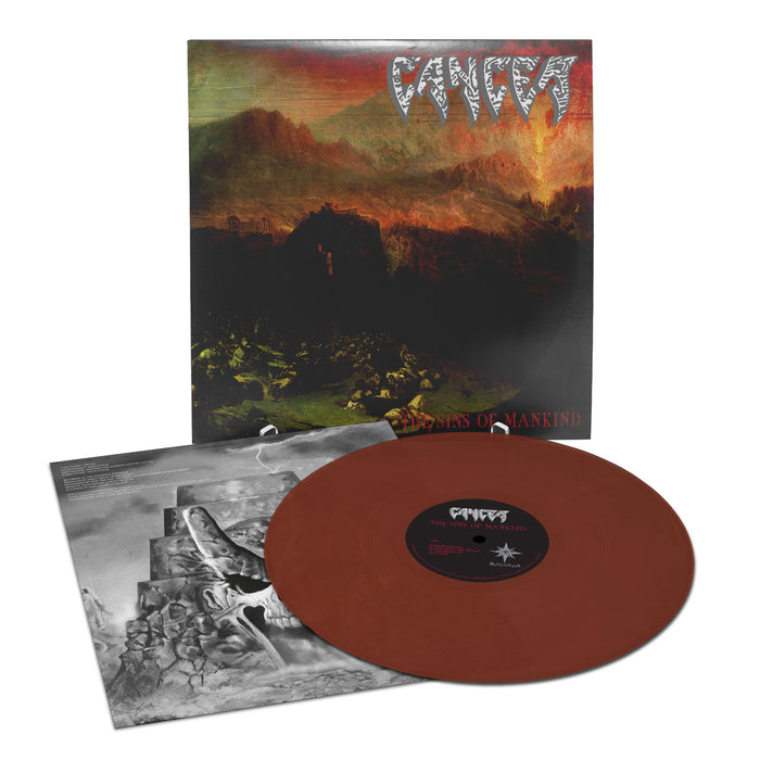 A brown limited edition vinyl record by Cancer with its sleeve and cover are shown. The cover art features a dark, apocalyptic landscape, jagged "Cancer" branding at the top, and mountains in the background.