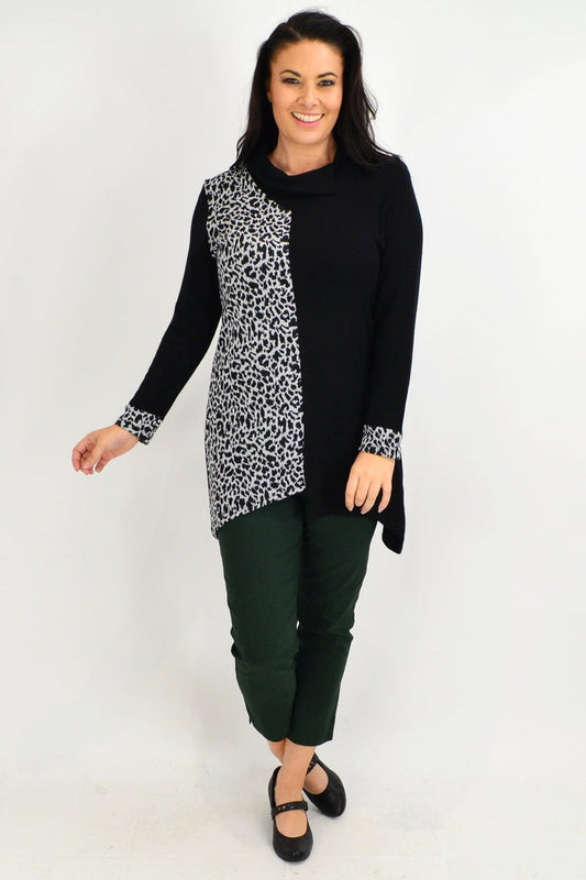 White leopard print cuff tunic top by Whispers, shown on a hanger with detailed fabric and cuff design.