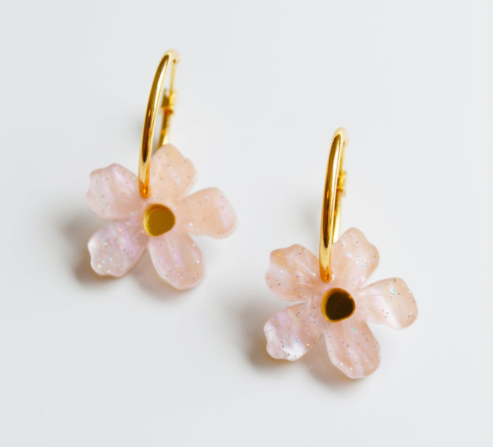 Pink flower drop earrings with mirror centre on a small gold hoop.