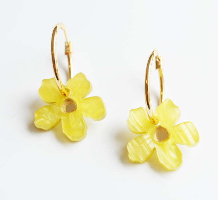 Yellow flower drop earrings with mirror centre on a small gold hoop.