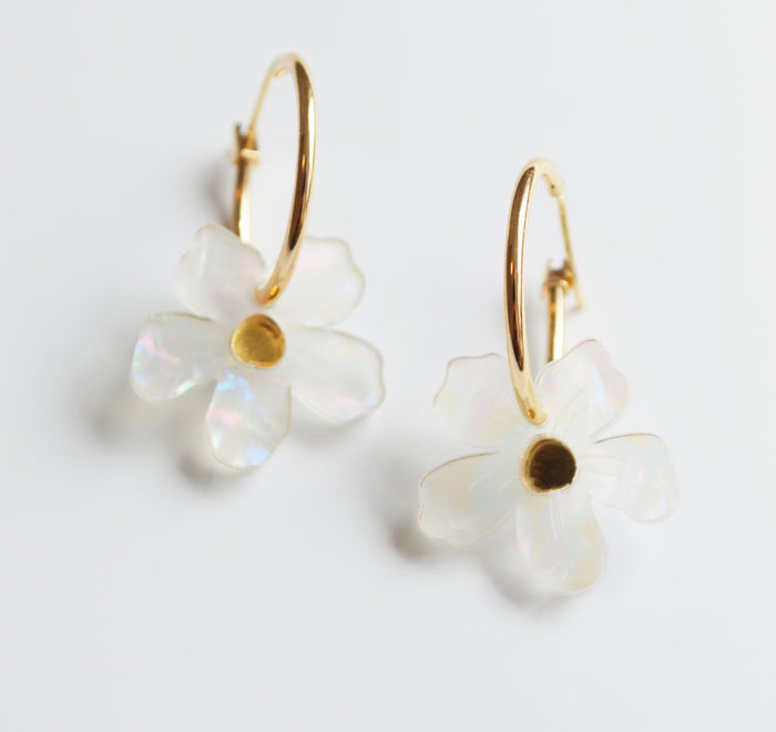 Pearl coloured flower drop earrings with mirror centre on a small gold hoop.