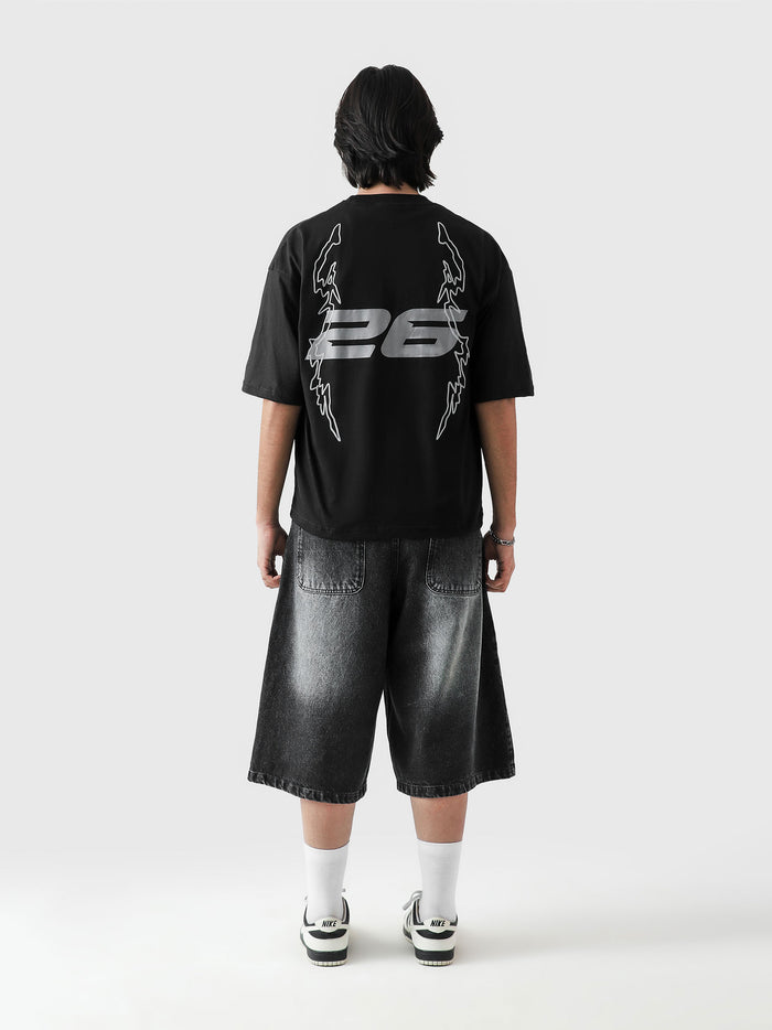Young and Turnt tee male model side angle oversized graphic Pakistan – GROOVY