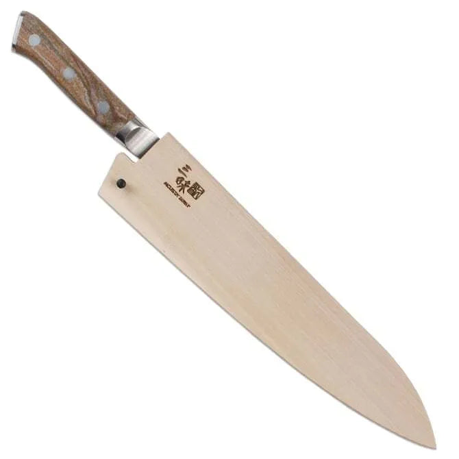 A Zanmai Pro Gyuto SE knife with a distinctive handle pattern and a natural wood saya cover.