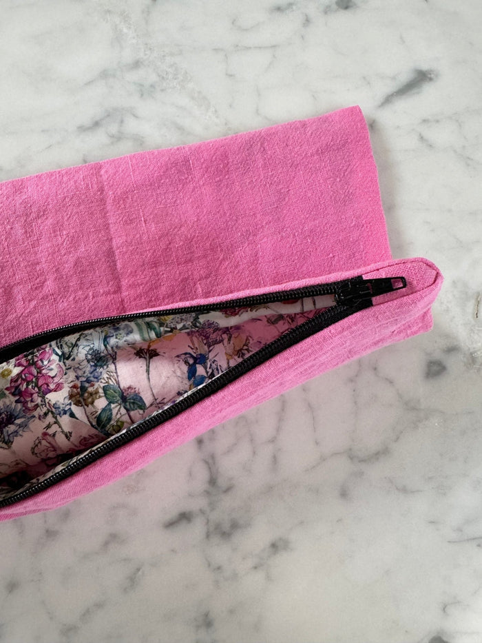 Floral lining inside pink zip top bag.